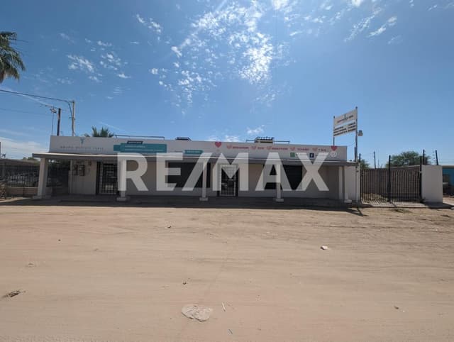 Terreno comercial con construcción