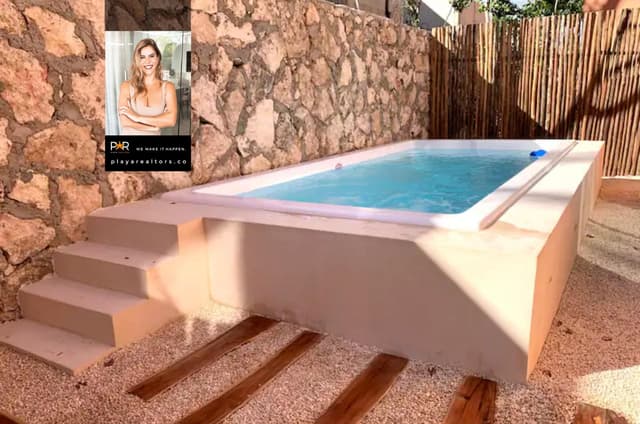 Apartamento de 2 Recámaras con Espaciosa Terraza y Diseño Sostenible en Tulum