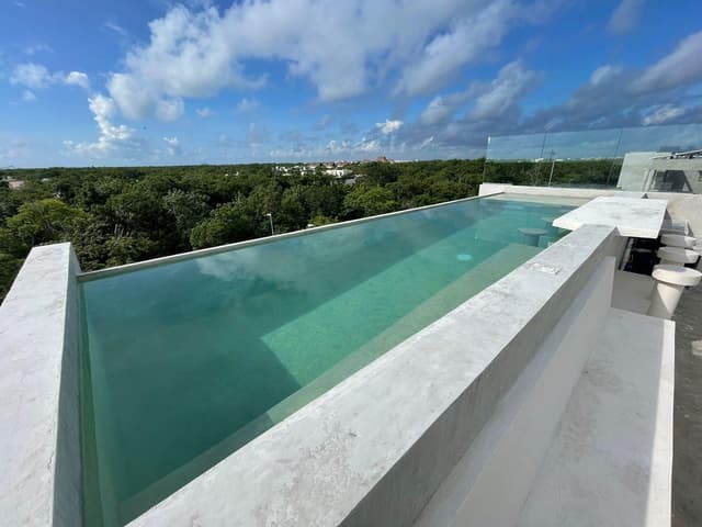 Condominio Amueblado de 2 Recámaras en Venta en Iguana Tulum, Aldea Zamámento
